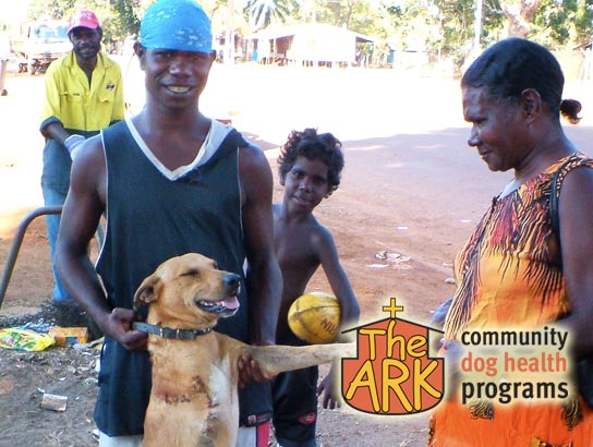 A recently treated dog in an indigenous community with his owners